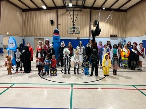 Large group of costumed participants at the costume contest