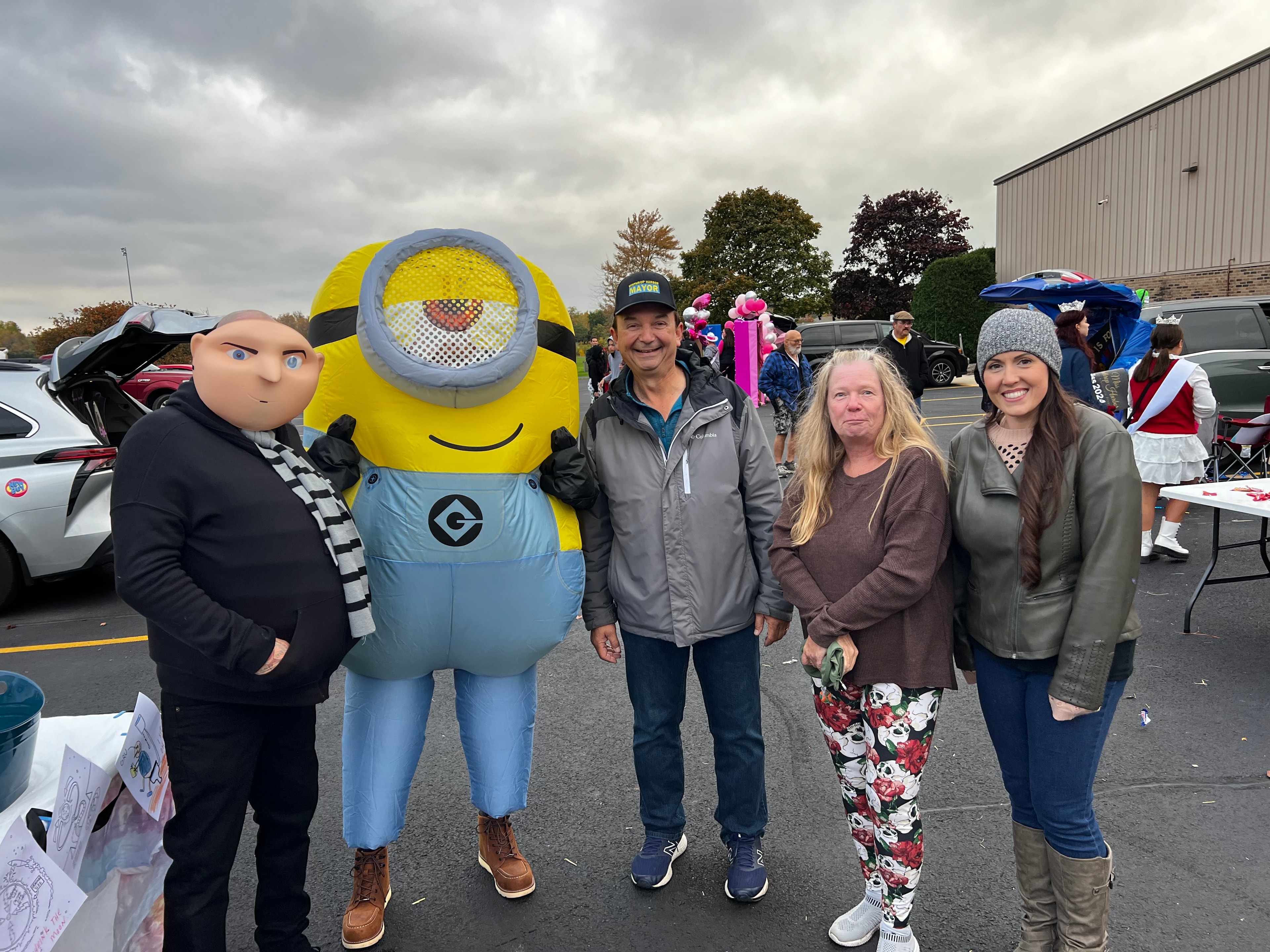 Mayor and Trustees posing with inflatable Minion costume